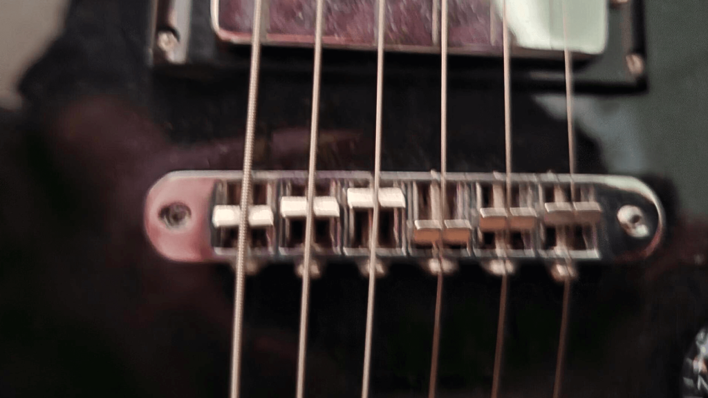 Intonating guitar saddles