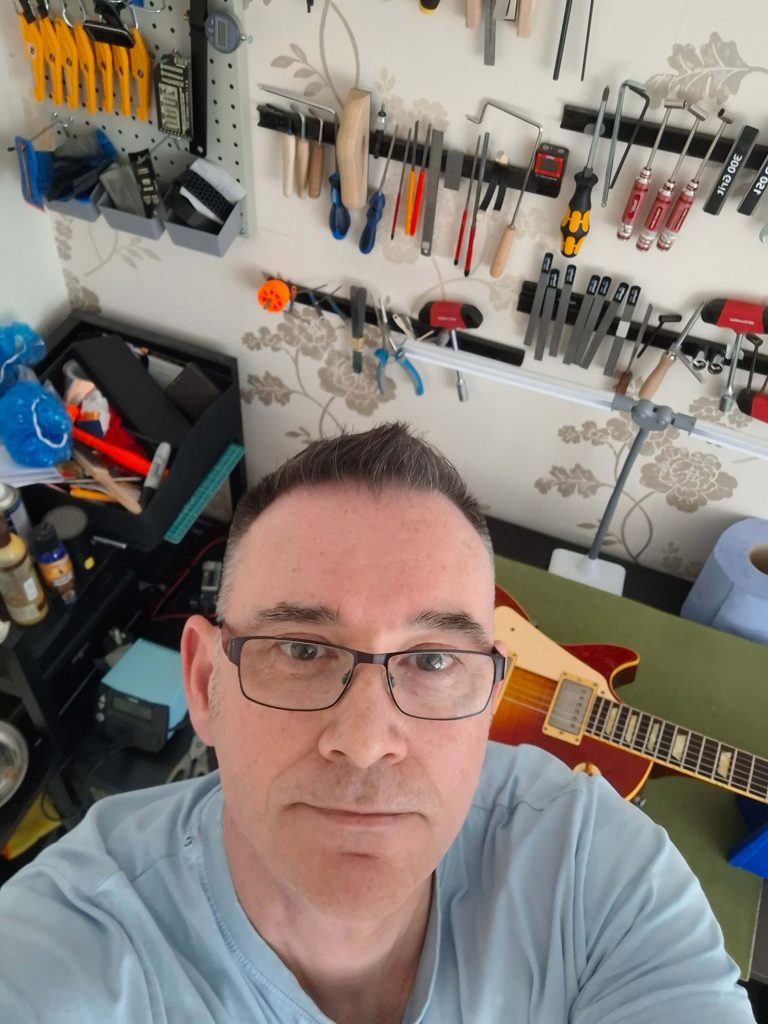 Photo of Stu from Stu's Guitar Setups in his Haywards Heath workshop