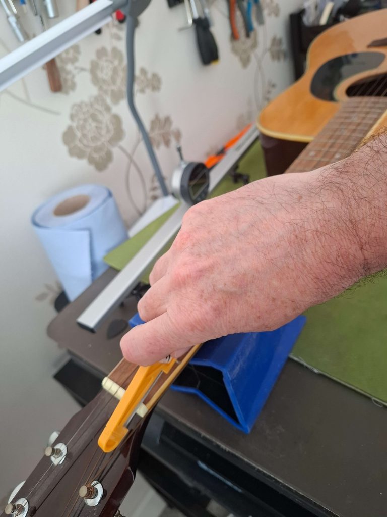 Filing nut slots to the correct height
