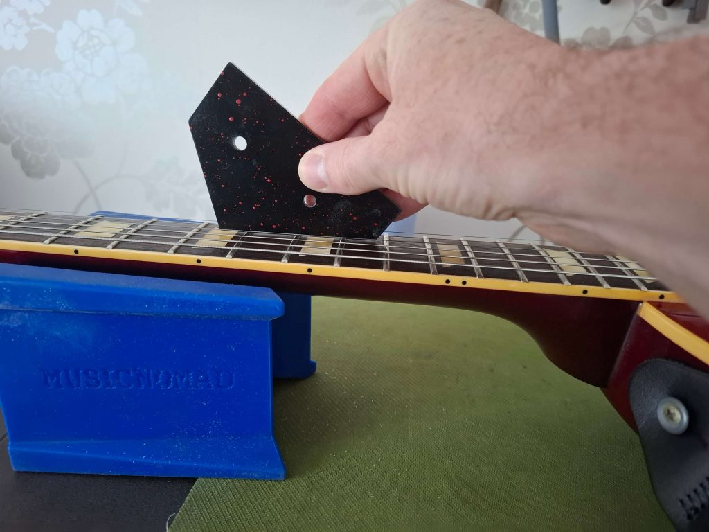 using a fret rocker to check for high frets
